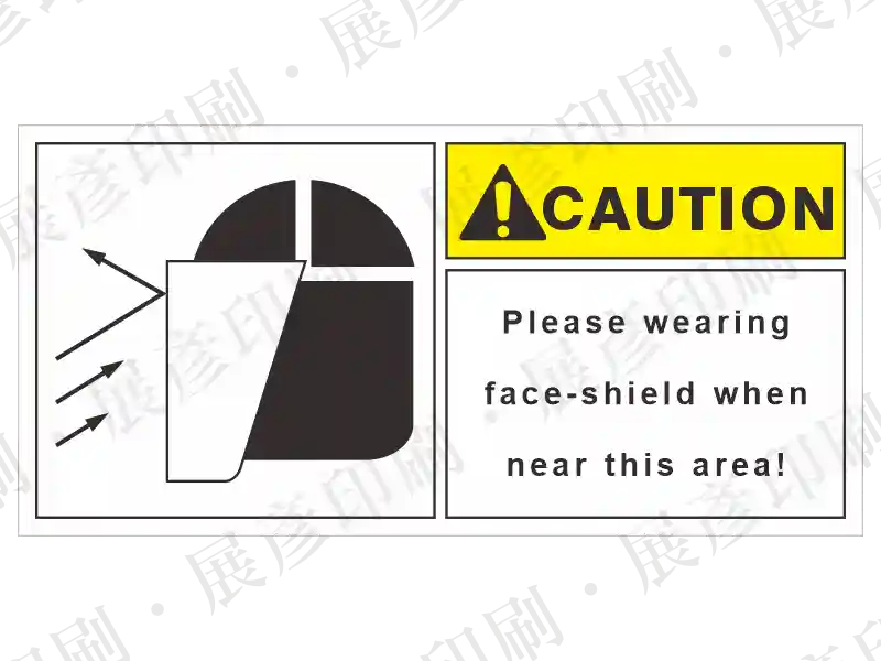 左側為戴面罩圖示，右側黃底「CAUTION」，文字「Please wearing face-shield when near this area!」。用途：配戴防護面罩警示。語系：英文