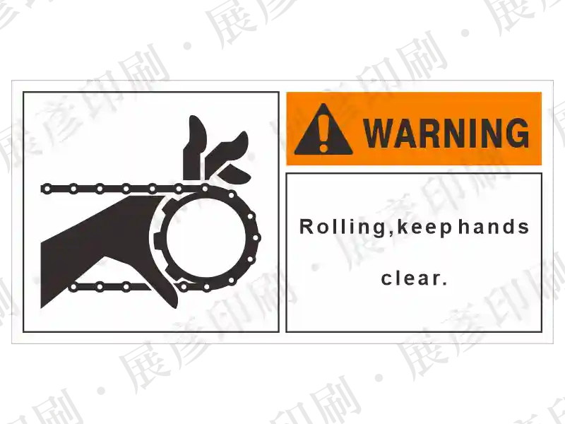 左側鍊條/皮帶捲入圖示,右側橘底「WARNING」,文字「Rolling, keep hands clear.」。用途:捲入危險警示。語系:英文