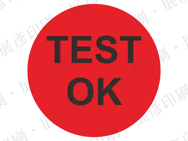 紅色底黑字，文字「TEST OK」。用途：測試通過標示。語系：英文