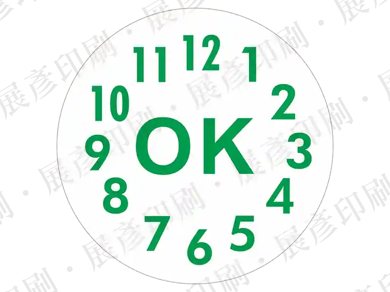 白色底綠字，鐘面刻度樣式，中間文字「OK」。用途：檢驗合格及時間標示。語系：英文