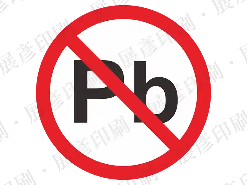 白底紅框，黑色「Pb」字樣上打紅色禁止線。用途：無鉛標示。語系：英文
